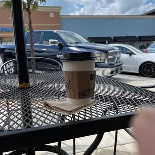 a cup of coffee on a table