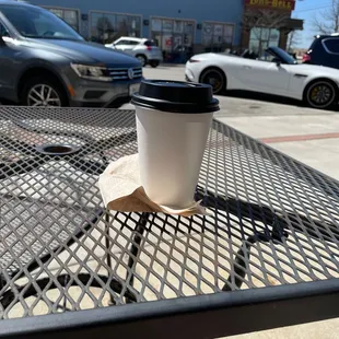 a cup of coffee on a table
