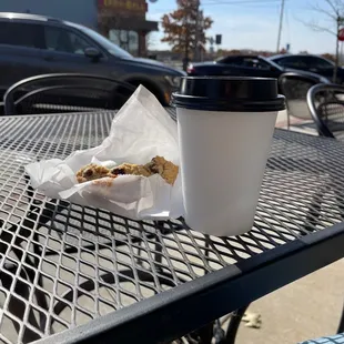 On the patio with a chocolate chip cookie and coffee