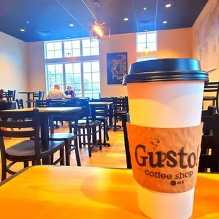 a cup of coffee on a table