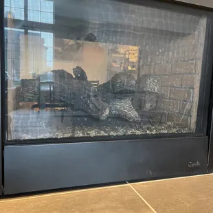 a fireplace in a coffee shop