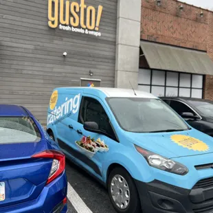 a blue van parked in a parking lot