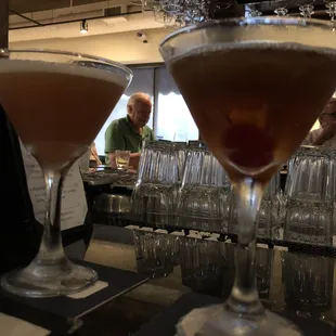 two martinis on a bar