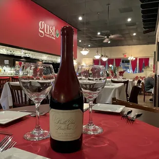 a bottle of wine on a table in a restaurant