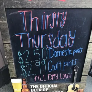 a chalk board with a beer on it