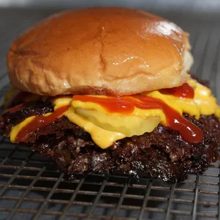 a hamburger with ketchup and mustard