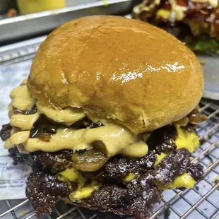 two burgers on a wire rack
