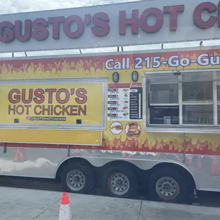 a food truck parked in front of a restaurant