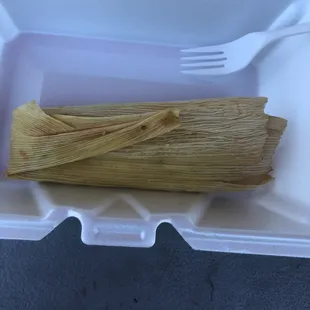 Served refrigerator cold(???) corn husk "Chicken" Tamale with no chicken.  Just a single 2" sliver of some kind of pepper.  Cold.