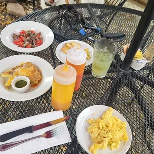 Spanish omelet with pesto, sauteed veggies, scrambled eggs (for pups) and Cristina with housemate olive tempanade.