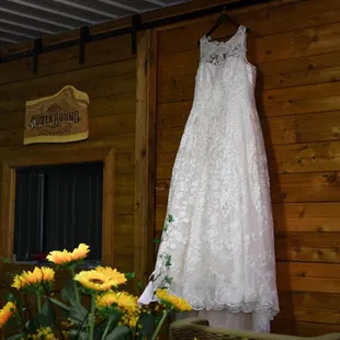 a wedding dress hanging on a wall