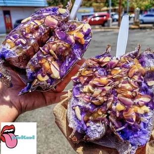 a person holding up a piece of food