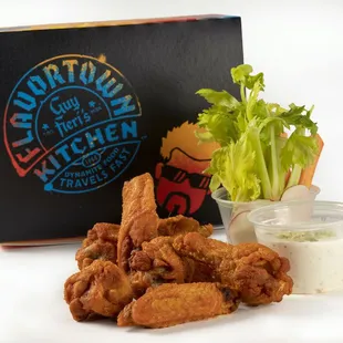 a box of chicken nuggies and a cup of ranch dressing