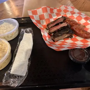Burnt and dried out ribs, nasty sausage, bland coleslaw, lame Mac n cheese
