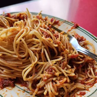 SPAGHETTI RUBBER NOODLES , NO MEAT IN SAUCE , NOT ENOUGH SAUCE TO COVER NOODLES