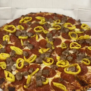 Pepperoni, banana peppers and homemade Italian sausage
