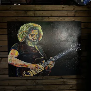 a painting of a man playing a guitar