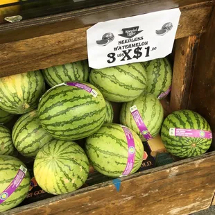 a display of watermelons and limes
