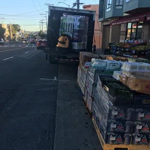 a truck carrying a crate of fruit