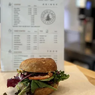 Veggie sandwich served on sourdough bagel