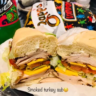 a turkey sandwich with a side of chips