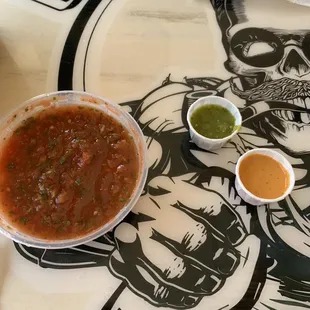 Salsa, Tomatillo, and Peanut (VERY spicy) sauces.