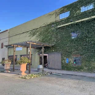 the outside of a building with vines growing on it