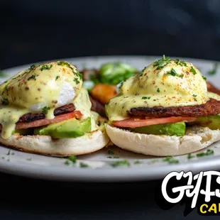 two eggs benedicts on a plate