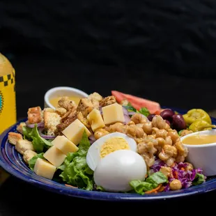 a salad with hard boiled eggs and cheese