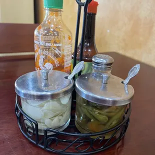 a table with condiments and condiments