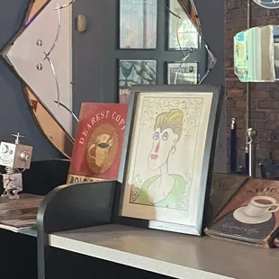 a mirror and a picture of a woman&apos;s face