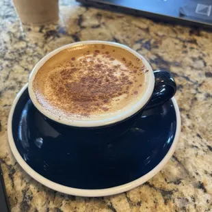 Cinnamon cortado (in a cappuccino cup)