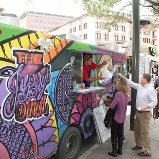 people ordering food from a food truck