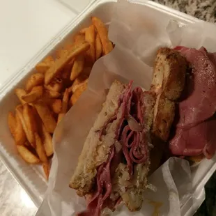 Reuben sandwich with spicy fries