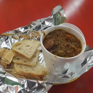 a bowl of chili and bread