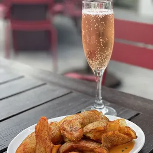 Pink bubbles and potatoes  Patatas Bravas