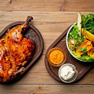 Lacquered Half Chicken/ seasonal pickles / sabzi salad/ chef's selection of sauces/ flatbread