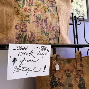 New cork bags from Portugal (light weight)! I bought one for traveling as the smaller ones lay flat.