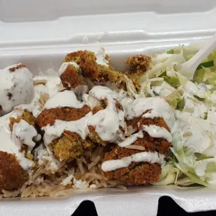 Drink and a "plate" of rice, salad and falafels= $8