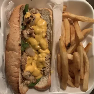 Chicken philly steak with onions, peppers, and cheese w/ a small order of fries.