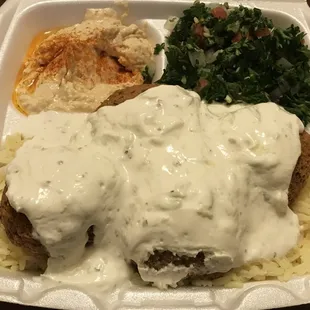This is the falafel plate/platter with rice and tabouleh.  I asked for the max legal limit on cucumber sauce lol so that is the sauce on top