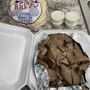 Pound of gyro meat, pita bread and sauce