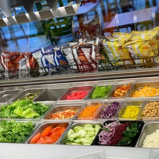 a variety of salads in containers