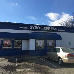 a car parked in front of a building