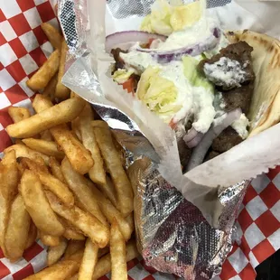 Lamb Gyro with seasoned fries ! That sauce tho!!!!