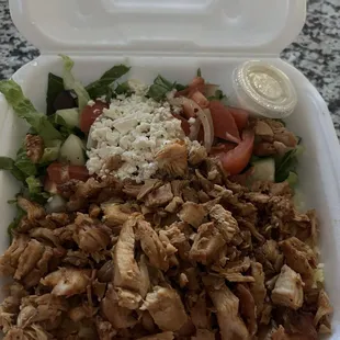 Chicken plate comes with rice and pita bread