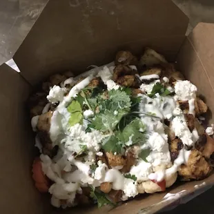 Chicken shawarma plate with extra salad, garlic sauce, tzaziki and feta