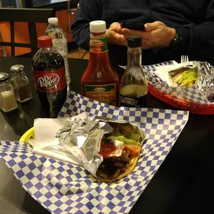 a man sitting at a table with food