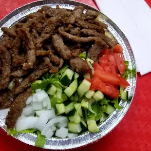 Gyro salad with rice at the bottom.