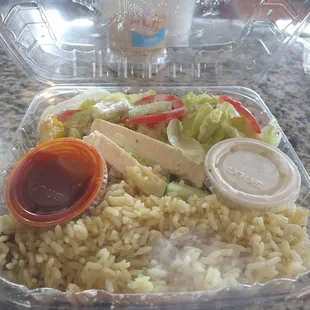 Greek salad with a side of rice. Combination was amazing house sauce was great if you love garlic . Tune into this place it was worth it.